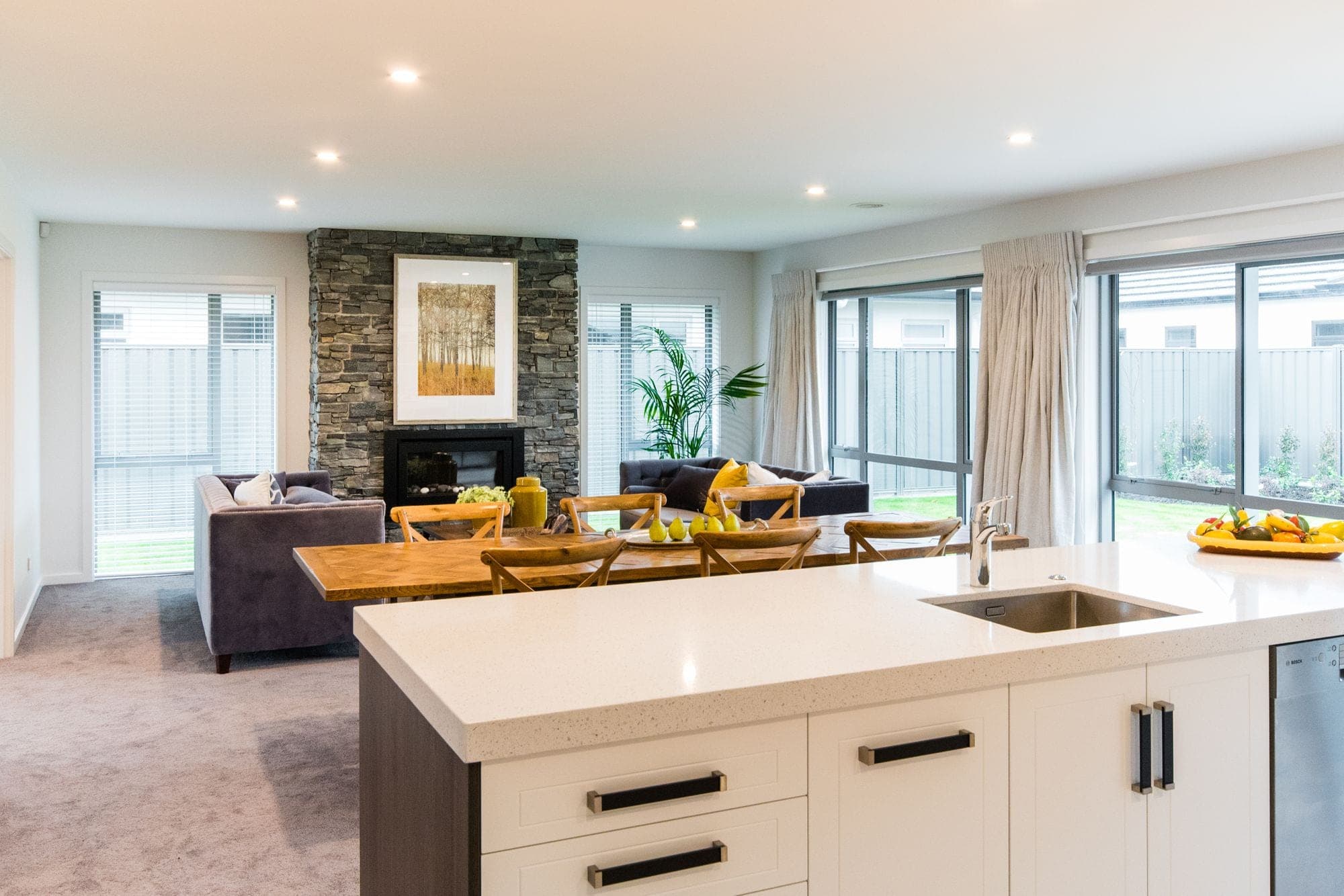 Open plan living with stone fireplace